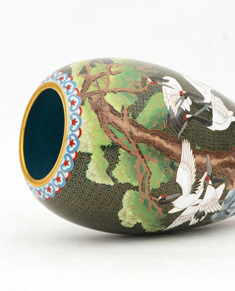 Close-up detail of the gold-plated copper rim and enamel crane standing pine pattern on this Royal Cloisonne vase,a premium piece for luxury home decor and home gifts