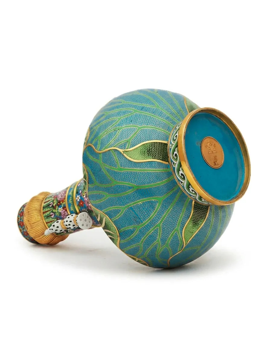 Close-up detail of the gold-plated copper rim and enamel lotus and butterfly pattern on this Royal Cloisonne vase,a premium piece for luxury home decor and home gifts